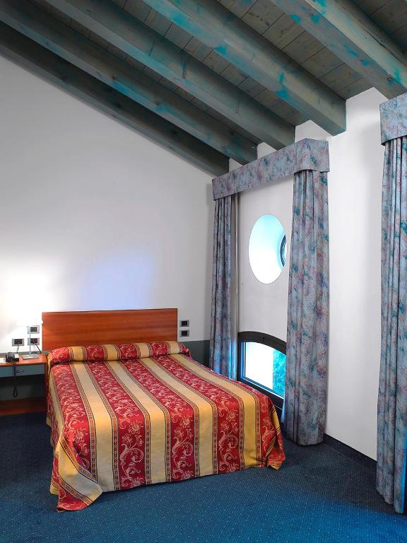 Postel nebo postele na pokoji v ubytování Hotel Filanda