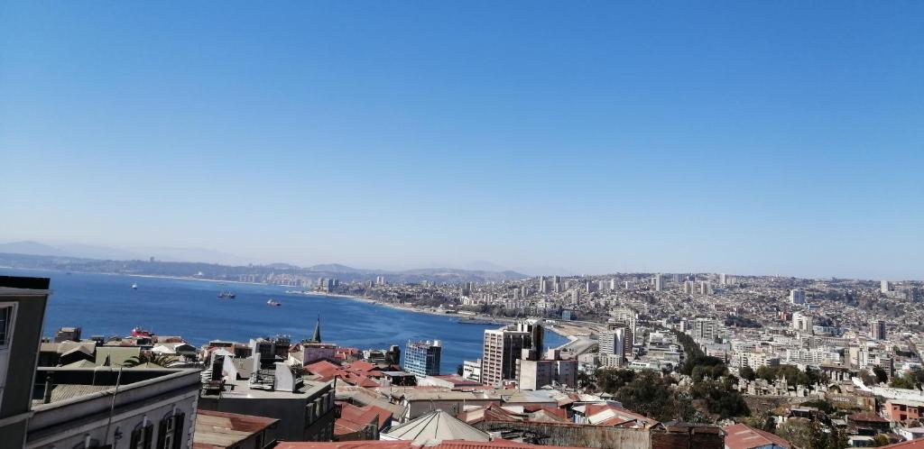 a city with tall buildings and a sky background at BO Hotel & Terraza in Valparaíso
