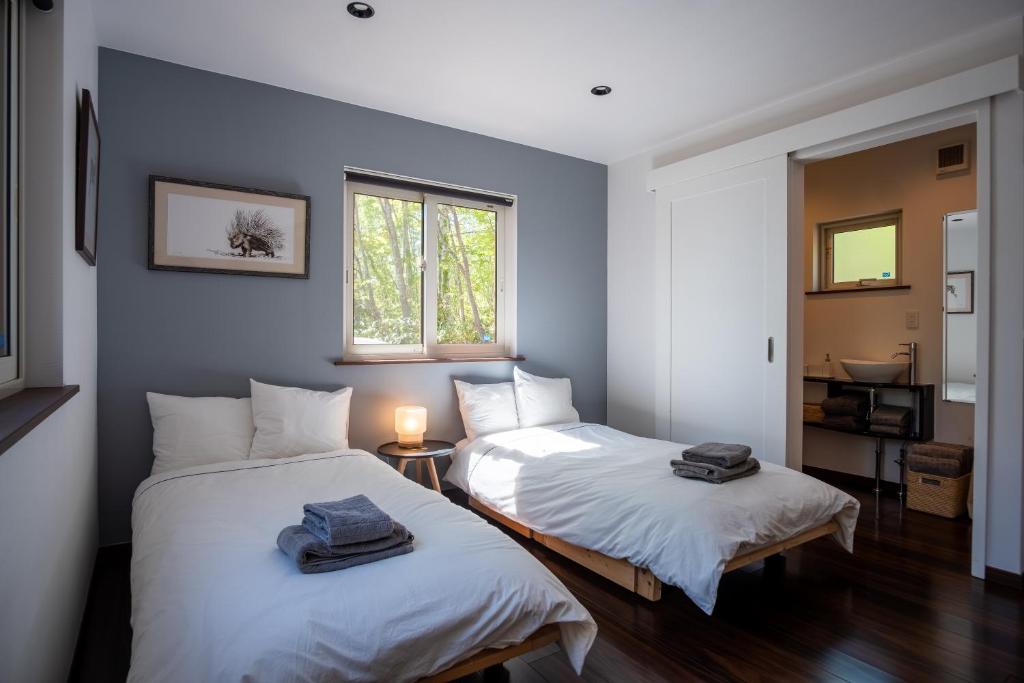 Postel nebo postele na pokoji v ubytování Forest Hideaway
