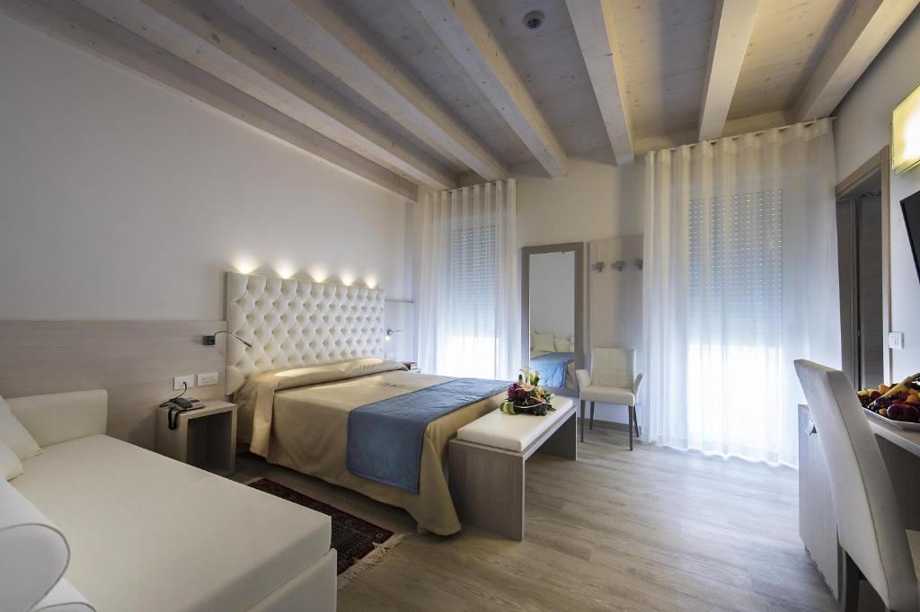 Postel nebo postele na pokoji v ubytování Hotel Hollywood***S