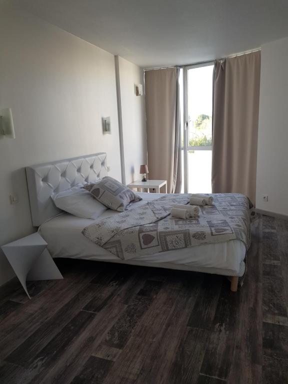Postel nebo postele na pokoji v ubytování Hotel La Clé