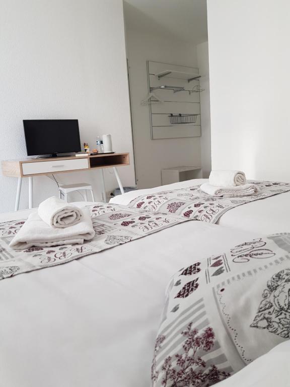 Postel nebo postele na pokoji v ubytování Hotel La Clé