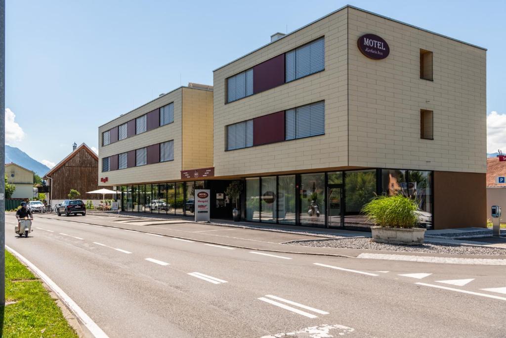 a building on the side of a road at Motel Keckeis Inn - Self Check-in in Sulz