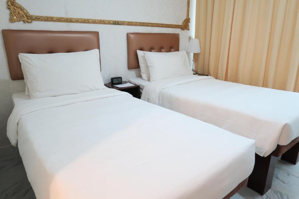 Ένα ή περισσότερα κρεβάτια σε δωμάτιο στο Best Western Plus Tsim Sha Tsui