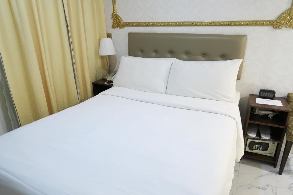 Ένα ή περισσότερα κρεβάτια σε δωμάτιο στο Best Western Plus Tsim Sha Tsui