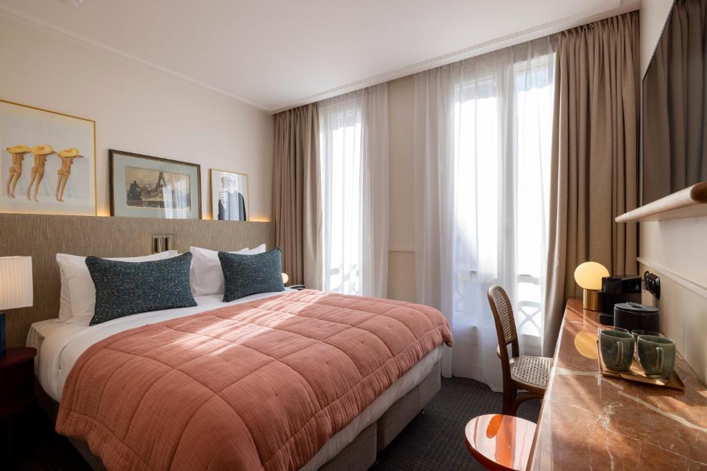Posteľ alebo postele v izbe v ubytovaní Hotel Dadou Paris