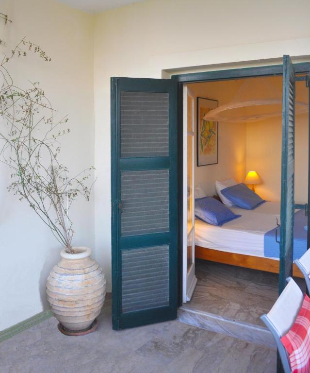 Postel nebo postele na pokoji v ubytování Lemoni Apartments