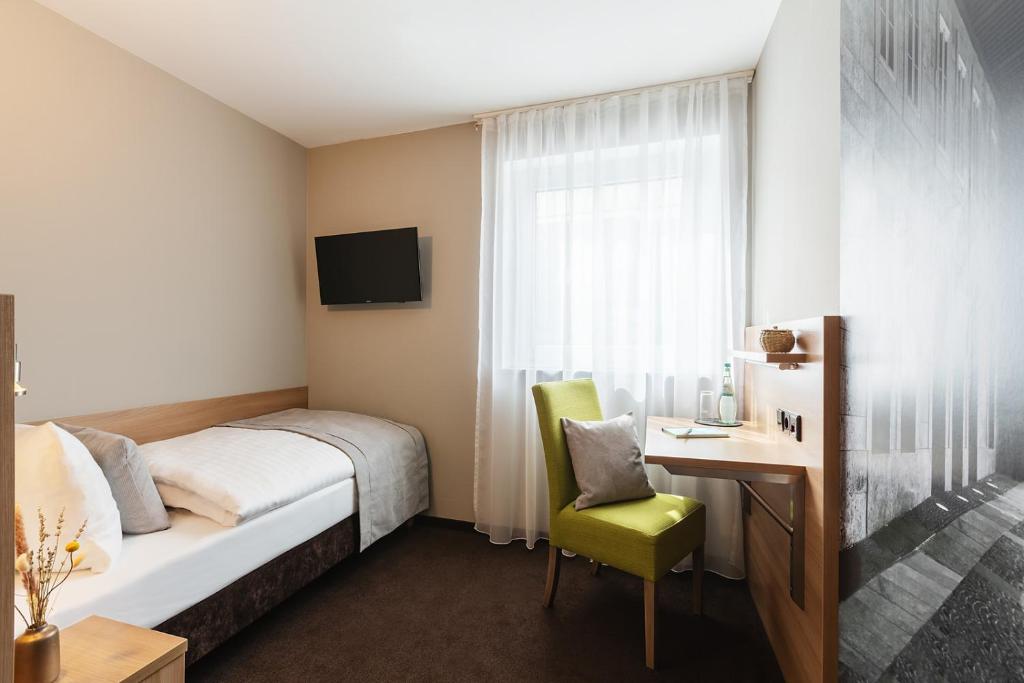 Postel nebo postele na pokoji v ubytování Novum Hotel Bruy