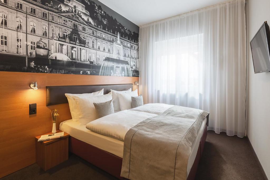 Postel nebo postele na pokoji v ubytování Novum Hotel Bruy