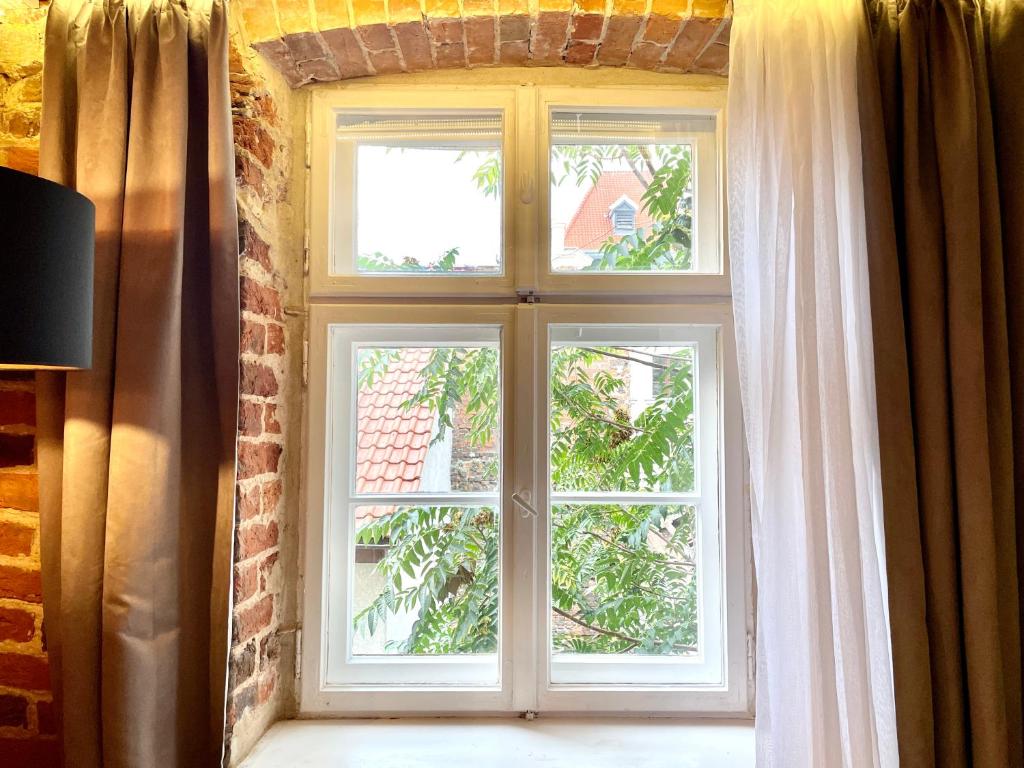 Televízia a/alebo spoločenská miestnosť v ubytovaní Maria 3 Apartment