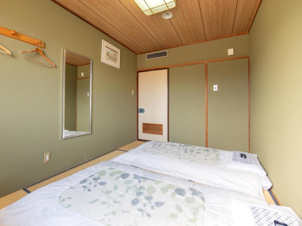 Postel nebo postele na pokoji v ubytování Tabist Hotel Sun Plaza Fuefuki Isawa