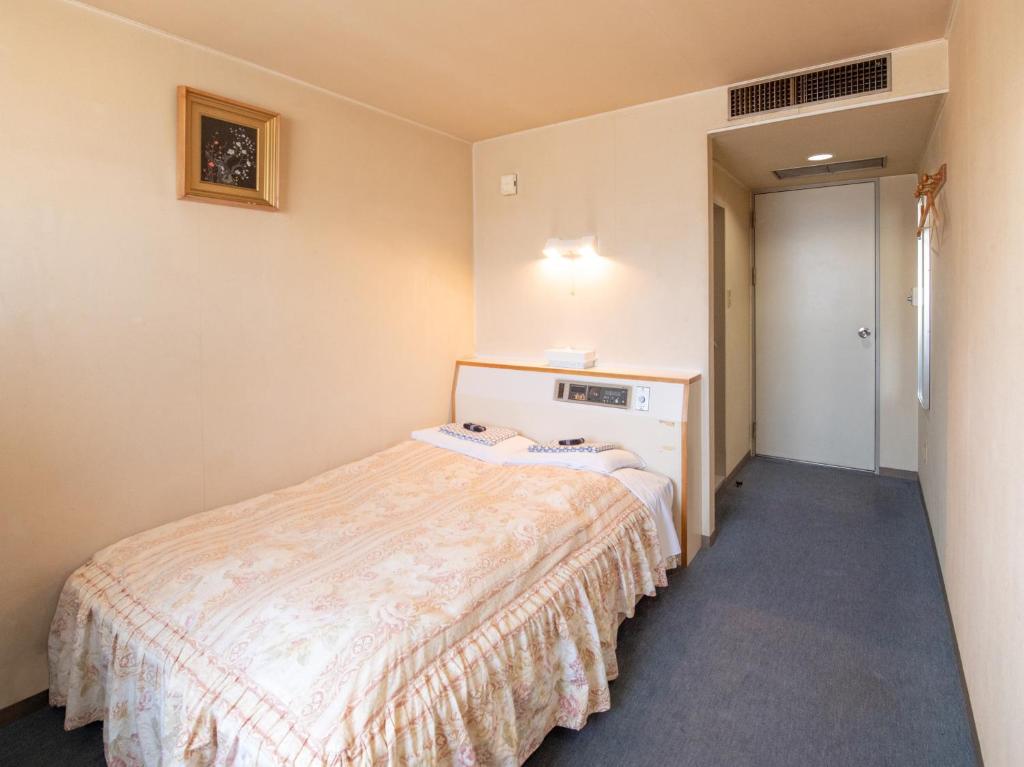 Postel nebo postele na pokoji v ubytování Tabist Hotel Sun Plaza Fuefuki Isawa