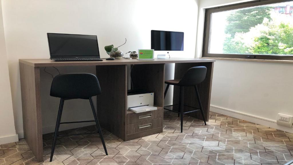 Televízia a/alebo spoločenská miestnosť v ubytovaní Holiday Inn Rome - Eur Parco Dei Medici by IHG