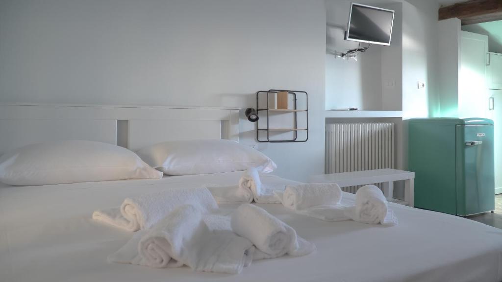 a bedroom with two beds with towels on them at Via Garibaldi 75 - Attic sea view in Camogli