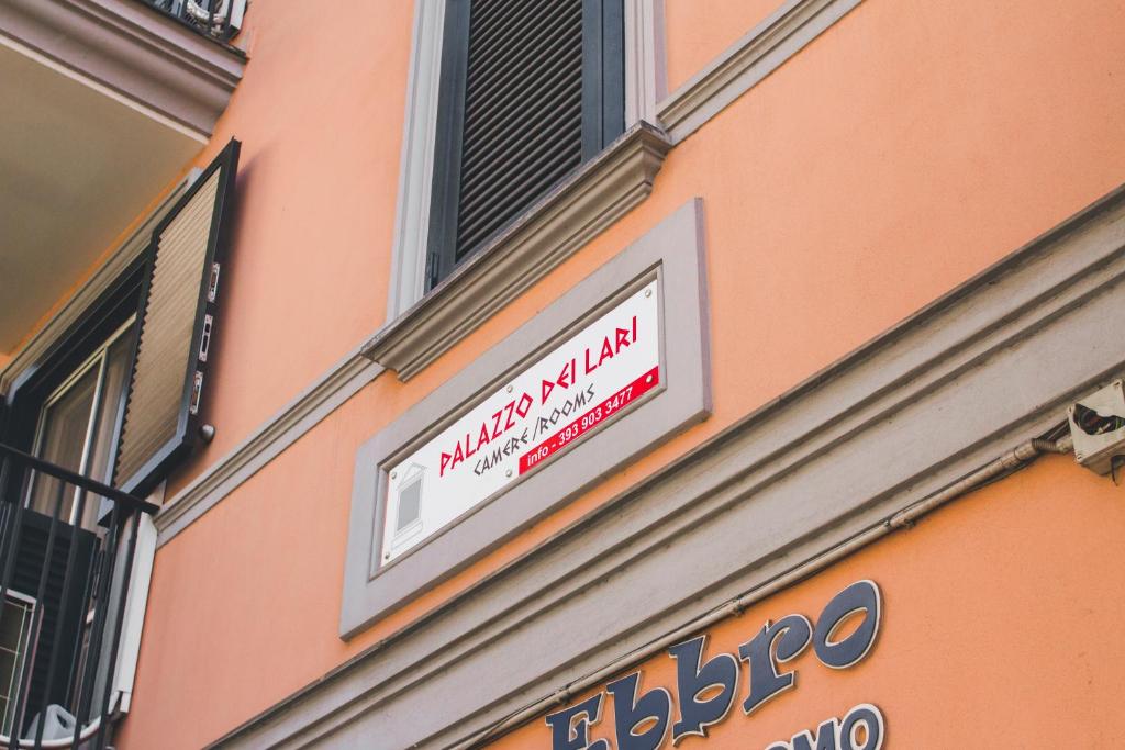 a sign on the side of a building at Palazzo dei Lari in Scafati
