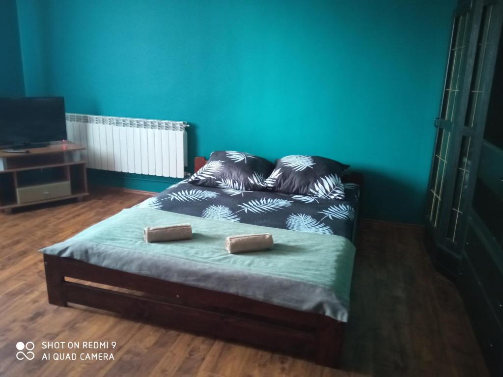 
Łóżko lub łóżka w pokoju w obiekcie Gosciniec sandomierski
