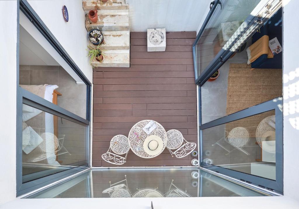 a display case with plates on a wooden wall at Charming house with terrace in Lisbon.WIFI. in Lisbon