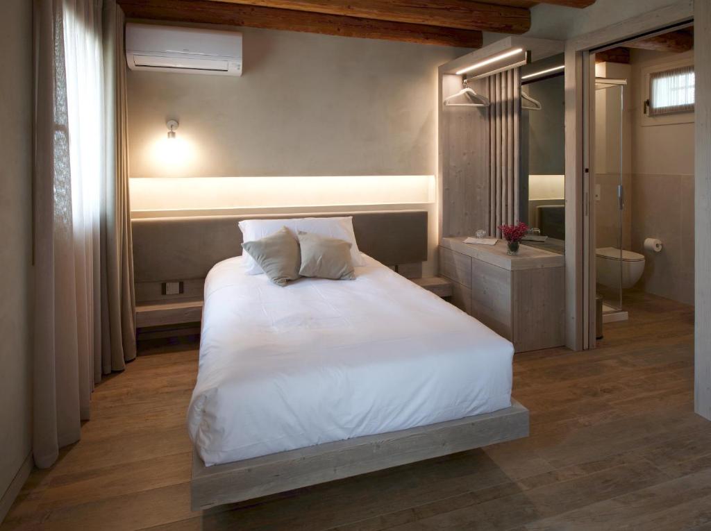 Posteľ alebo postele v izbe v ubytovaní Locanda MaMaGiò