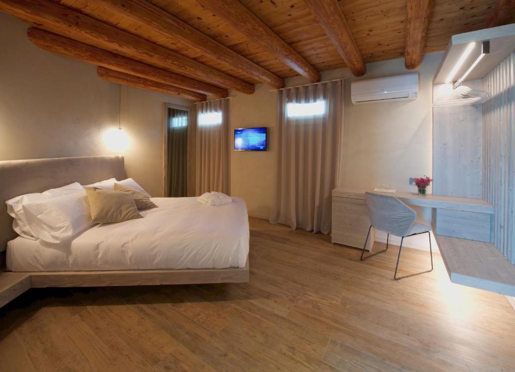 Posteľ alebo postele v izbe v ubytovaní Locanda MaMaGiò