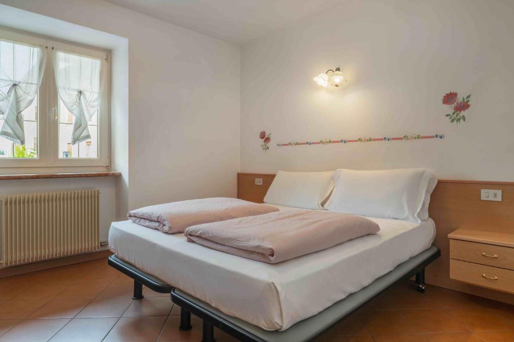 Postel nebo postele na pokoji v ubytování Appartamenti Decarli