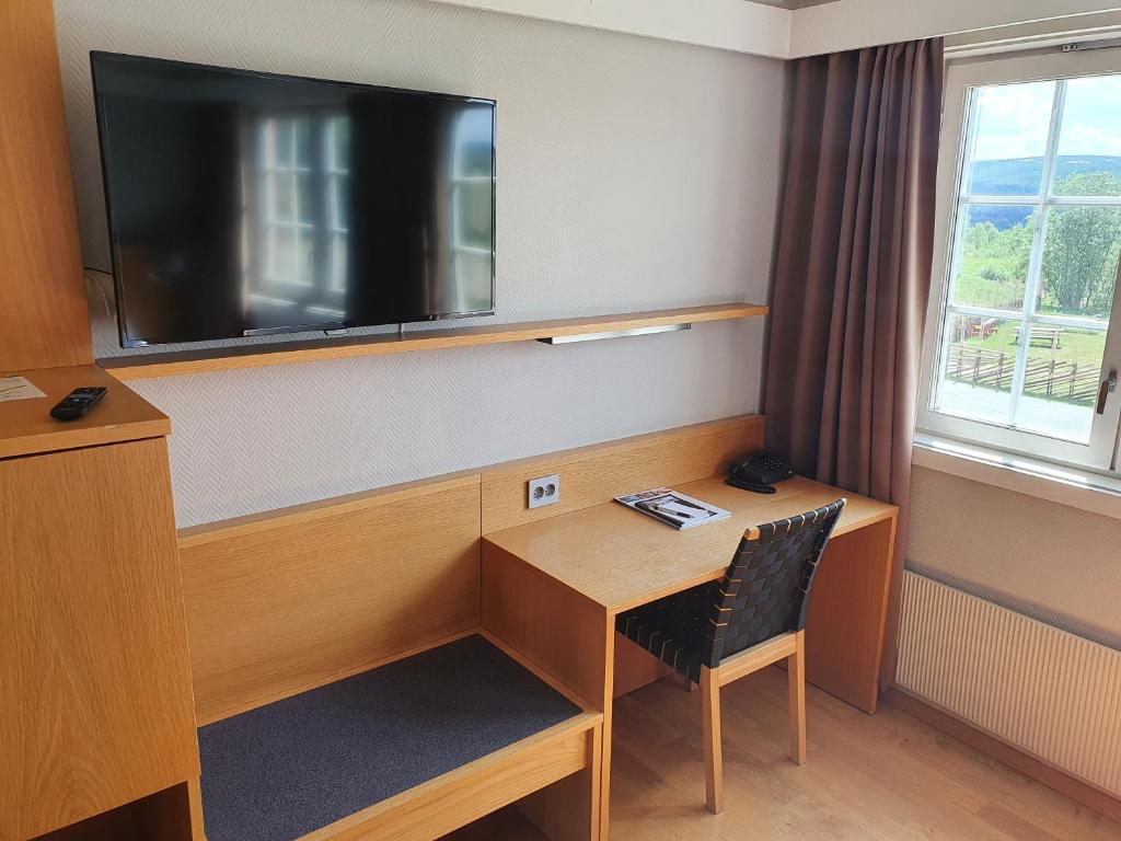 TV a/nebo společenská místnost v ubytování Røros Hotell - Bad & Velvære
