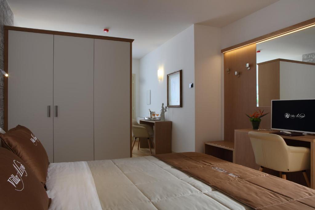 Postel nebo postele na pokoji v ubytování Agriturismo Villa Almè