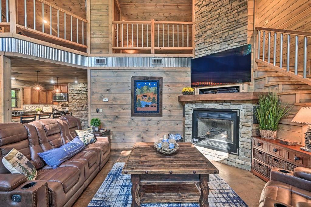 a living room with a couch and a fireplace at Luxe Cabin with Tesla Charging Station, 3 Mi to Lake in Stephens Gap
