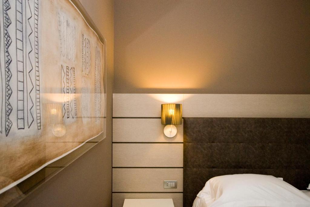 Postel nebo postele na pokoji v ubytování Hotel Glamour