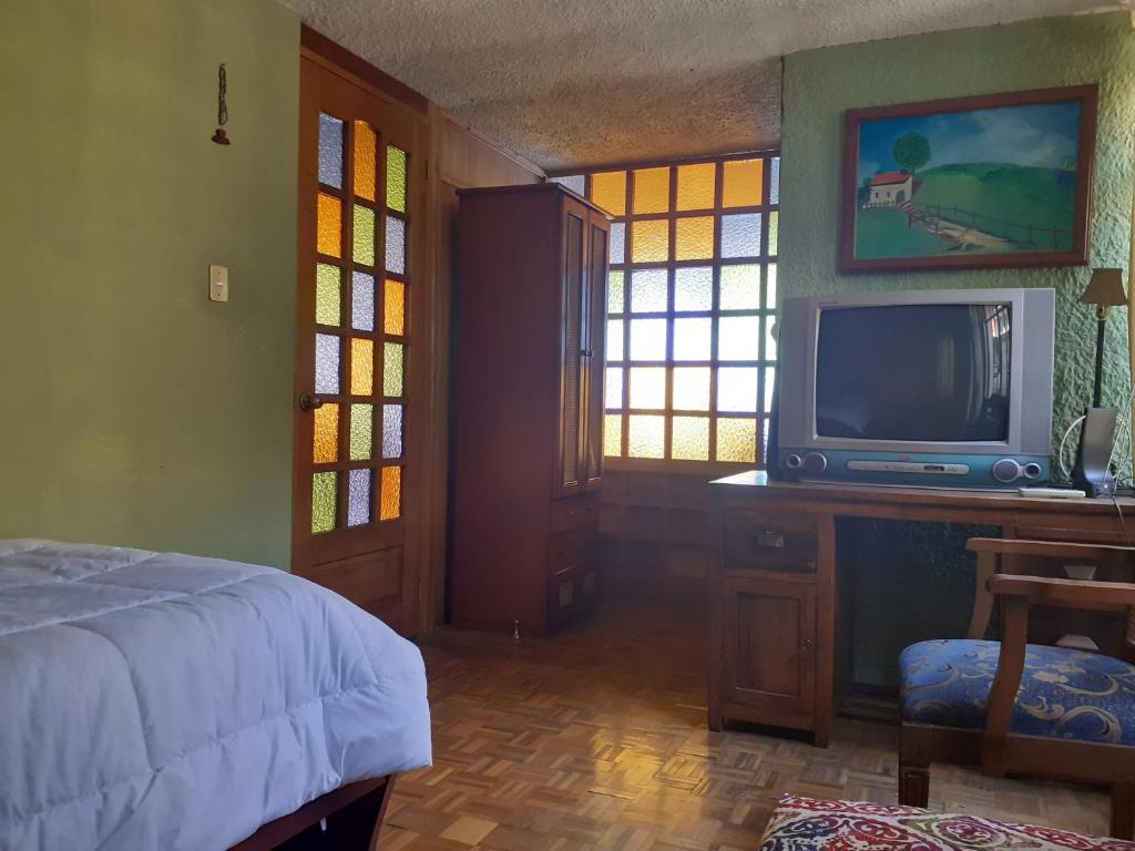 TV a/nebo společenská místnost v ubytování Casa de Tulia
