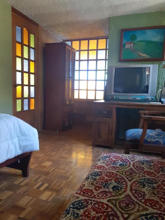 TV a/nebo společenská místnost v ubytování Casa de Tulia