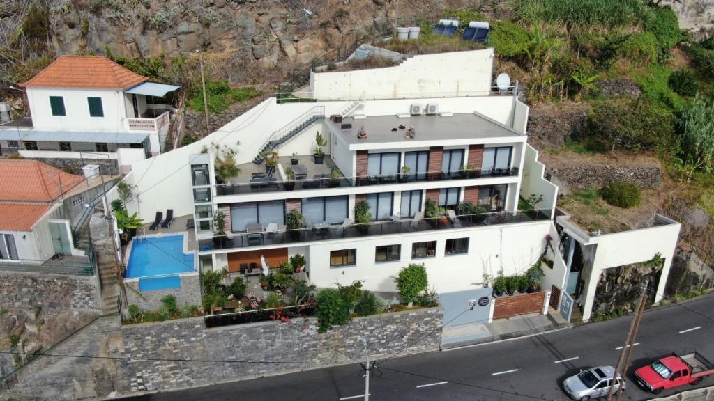 an aerial view of a white house at Guesthouse-TheView in Ribeira Brava
