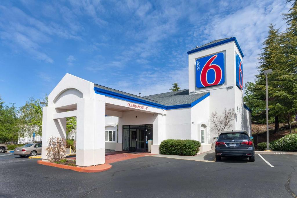 a koreanorean gas station with a sign on it at Motel 6-Auburn, CA in Auburn