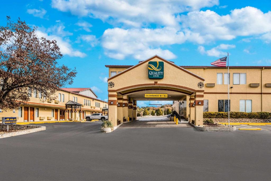 aury inn suites on the road with a parking lot at Quality Inn Ozona I-10 in Ozona