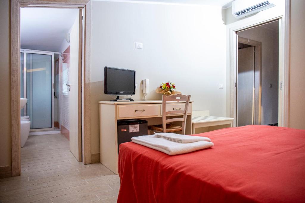 TV a/nebo společenská místnost v ubytování Hotel Al Rustico