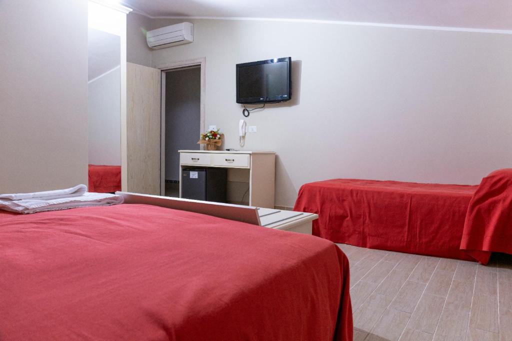 Postel nebo postele na pokoji v ubytování Hotel Al Rustico