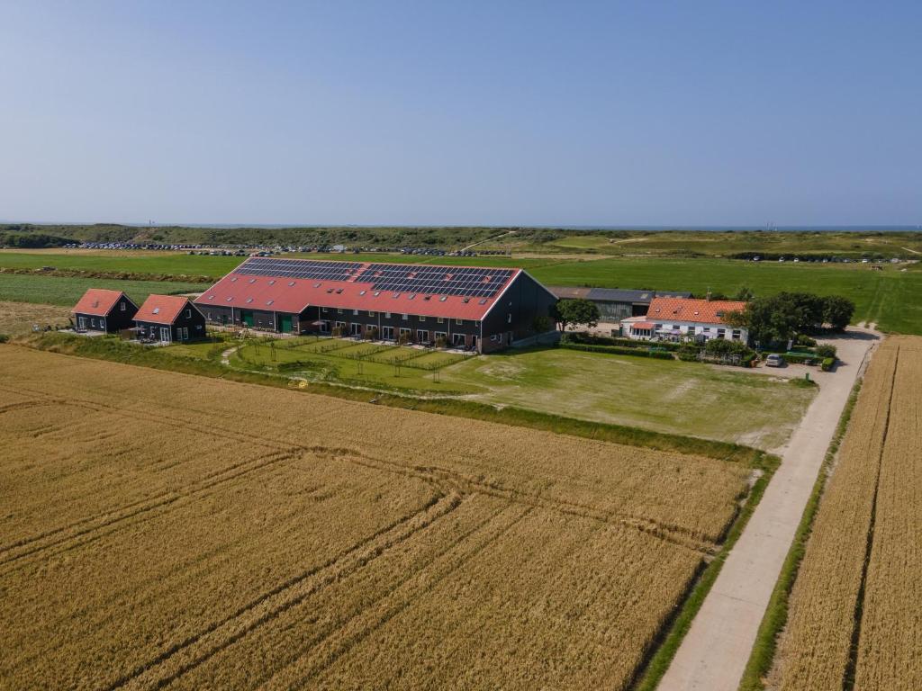 an aerial view of a farm and a field at Hof Babel in Domburg