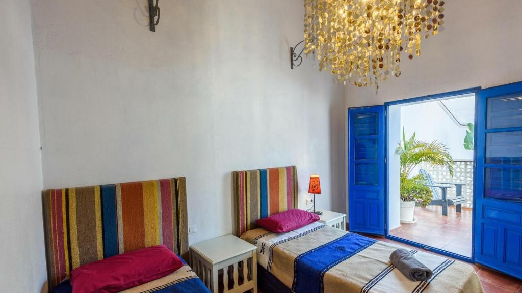 A bed or beds in a room at Villa El Patio Andaluz Velez-Malaga by Ruralidays