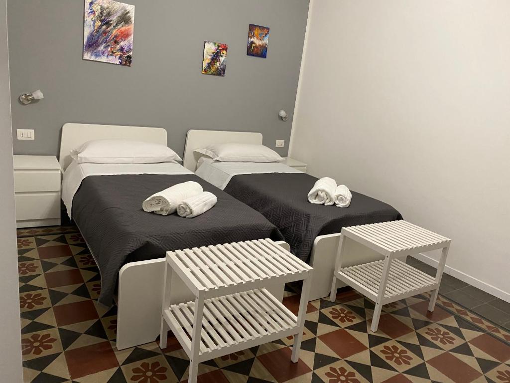 Łóżko lub łóżka w pokoju w obiekcie Antica Dimora Maravigna