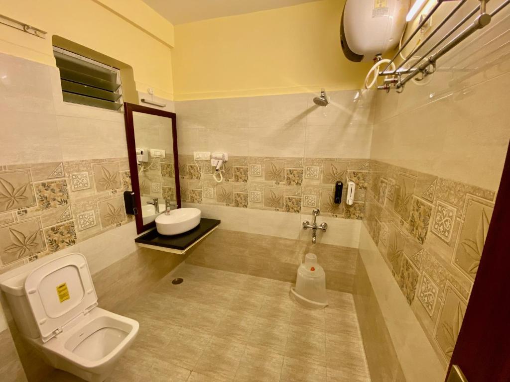 Koupelna v ubytování Aakash Rooms and Cottages,