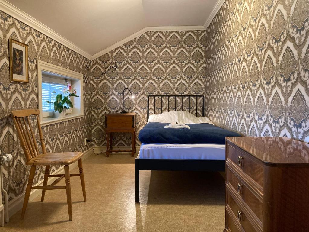 Un pat sau paturi într-o cameră la Gramersgården