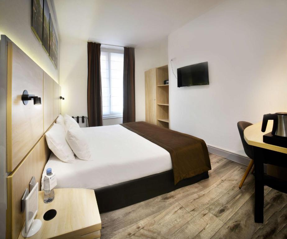 Postel nebo postele na pokoji v ubytování Best Western Lyon Saint-Antoine
