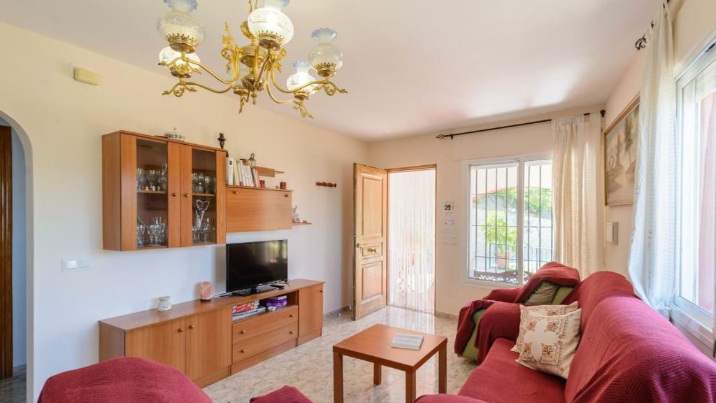 Televízia a/alebo spoločenská miestnosť v ubytovaní Casa Charnite Competa by Ruralidays