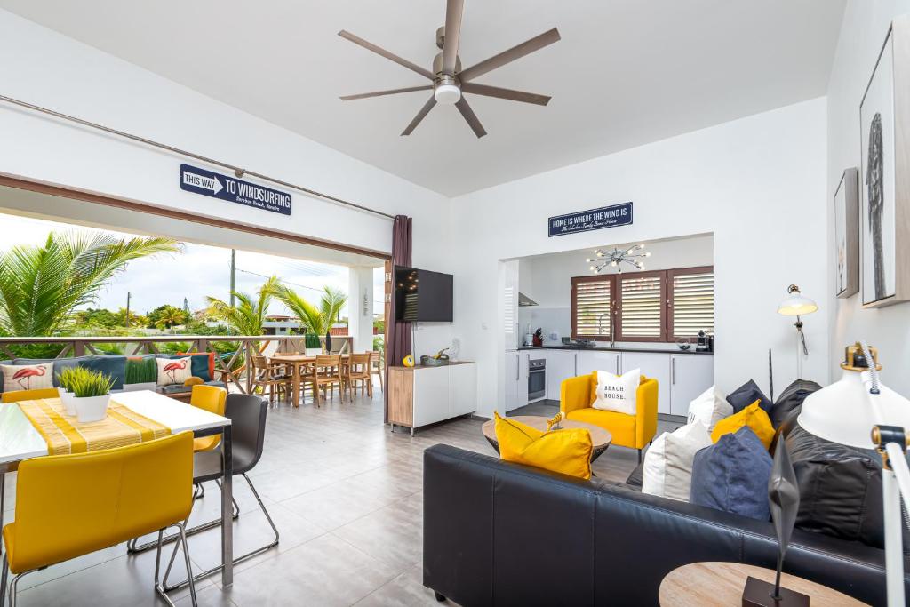 a living room with a couch and chairs and a table at Villa Chica 3 min to Beach, Diving & Restaurants with Pool and private Garden 10 min to Windsurfing & Kitesurfing in Belnem