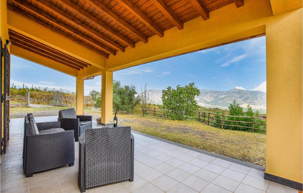 an outdoor patio with a view of the mountains at Stunning Home In Castiglione Di S With Wifi And 2 Bedrooms in Solicchiata