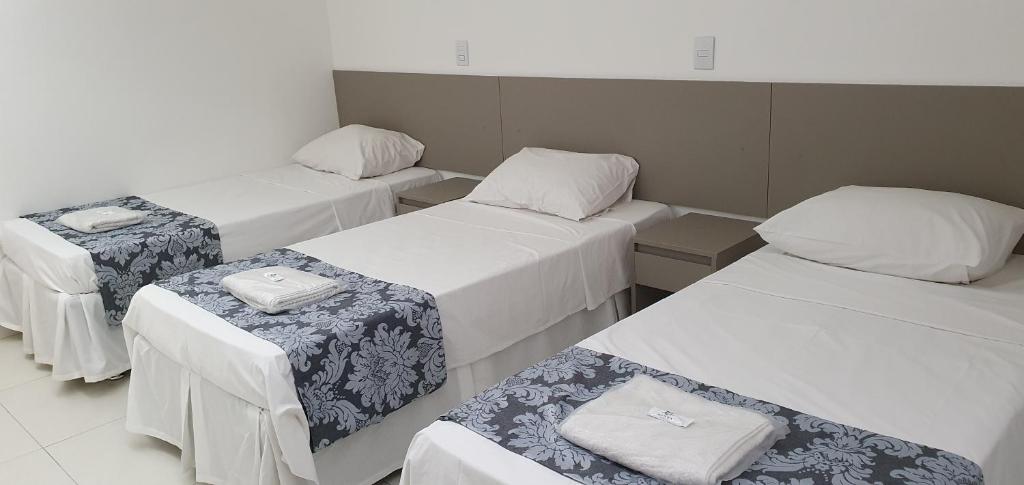 Postel nebo postele na pokoji v ubytování Hotel Hellyus