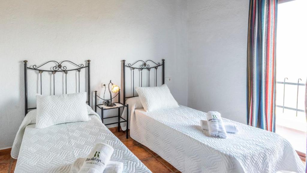 Postel nebo postele na pokoji v ubytování Villa Melendez Almachar by Ruralidays