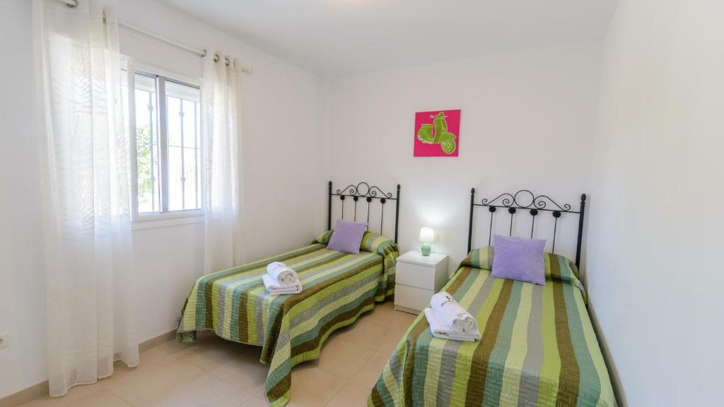 Postel nebo postele na pokoji v ubytování Villa Jazmin Vinuela by Ruralidays