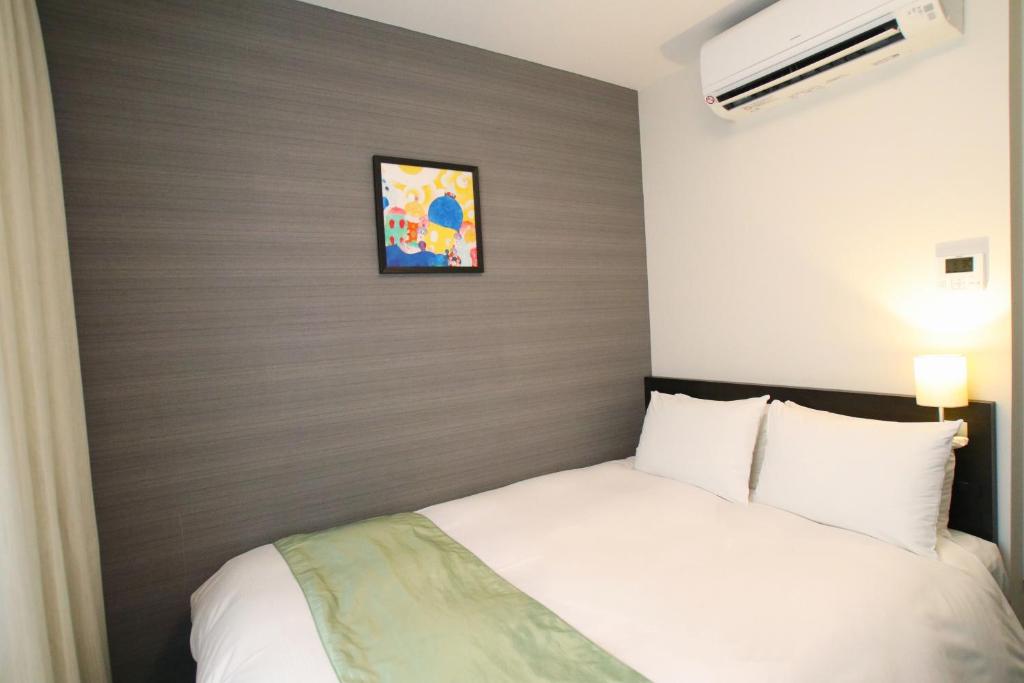 Postel nebo postele na pokoji v ubytování Hotel Gran Ms Kyoto