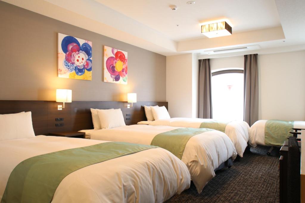 Postel nebo postele na pokoji v ubytování Hotel Gran Ms Kyoto