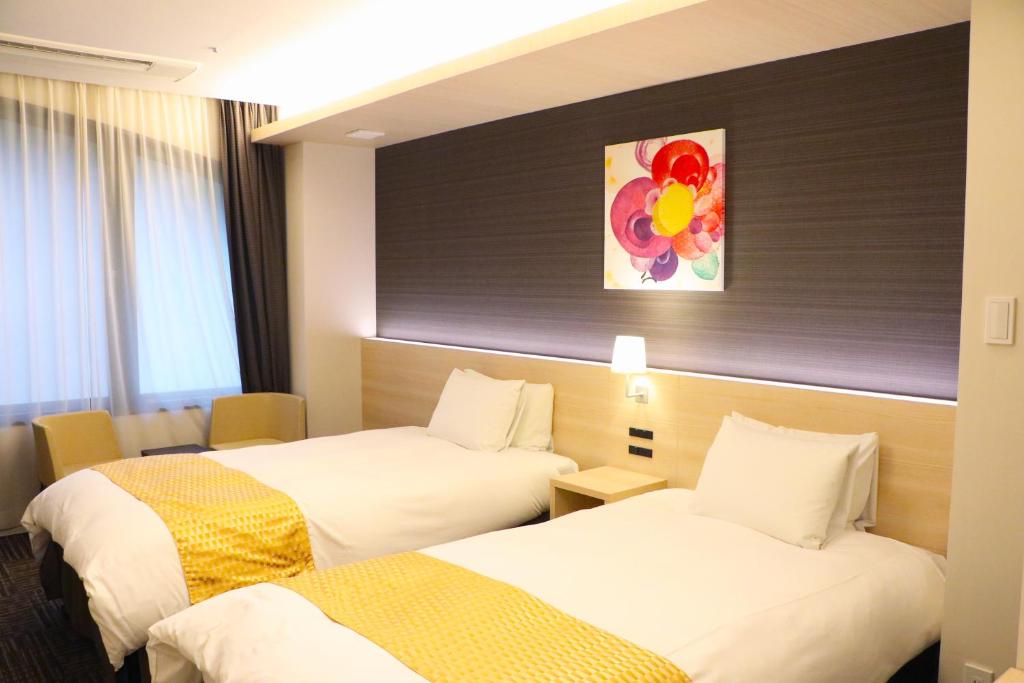 Postel nebo postele na pokoji v ubytování Hotel Gran Ms Kyoto